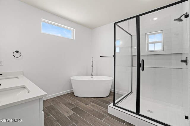 bathroom featuring vanity and independent shower and bath