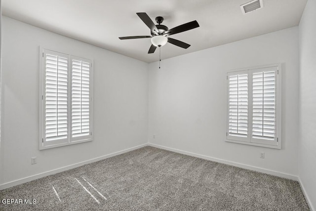 carpeted empty room with ceiling fan