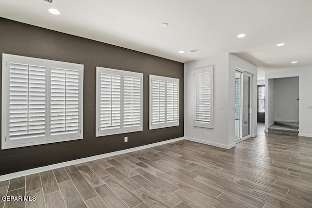 spare room featuring hardwood / wood-style floors