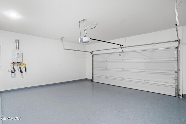 garage with tankless water heater and a garage door opener