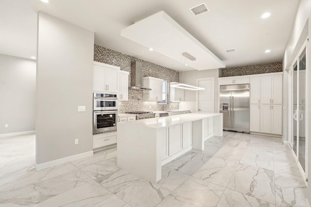 5532 Ventana Del Sol Dr, El Paso, TX 79912 - kitchen featuring stainless steel appliances, sink, wall chimney exhaust hood, a center island, and white cabinets