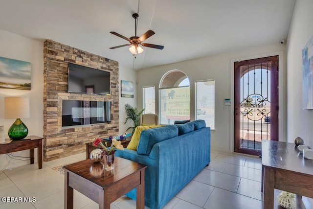 living room with ceiling fan and light tile floors