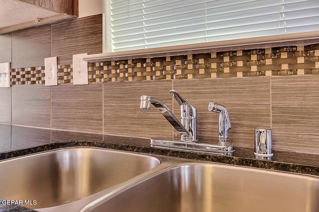 interior details featuring sink and a bath to relax in