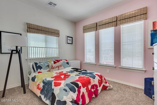 bedroom featuring light colored carpet