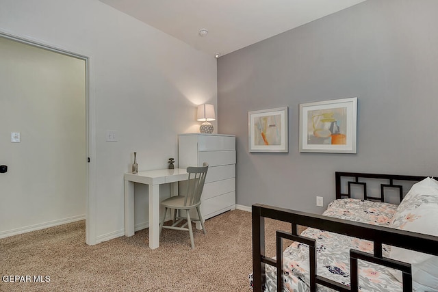 bedroom featuring light carpet