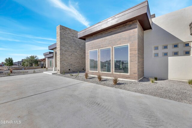 469 Country Oaks Dr, El Paso, TX 79932 - view of side of home featuring a patio area