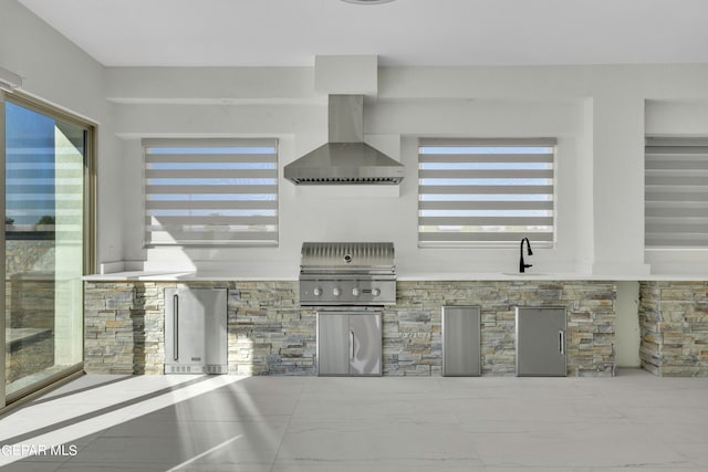 469 Country Oaks Dr, El Paso, TX 79932 - kitchen with stainless steel fridge, wall chimney range hood, sink, and a wealth of natural light