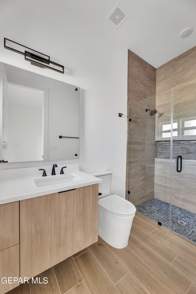 469 Country Oaks Dr, El Paso, TX 79932 - bathroom with walk in shower, vanity, and toilet