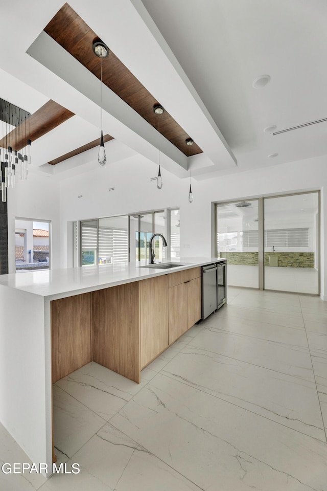 469 Country Oaks Dr, El Paso, TX 79932 - kitchen with pendant lighting, beamed ceiling, sink, and stainless steel dishwasher