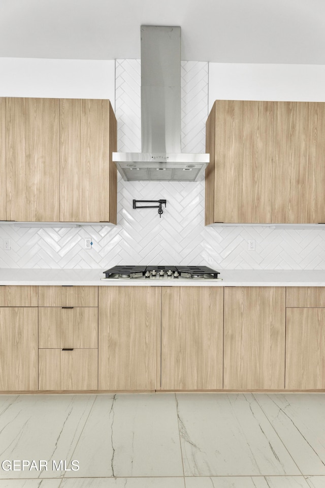 469 Country Oaks Dr, El Paso, TX 79932 - kitchen featuring wall chimney exhaust hood, backsplash, stainless steel gas cooktop, and light brown cabinets