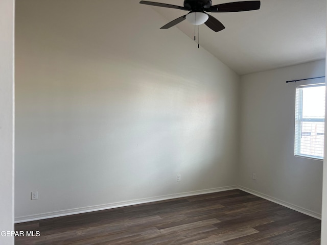 empty room with ceiling fan, vaulted ceiling, and dark hardwood / wood-style flooring