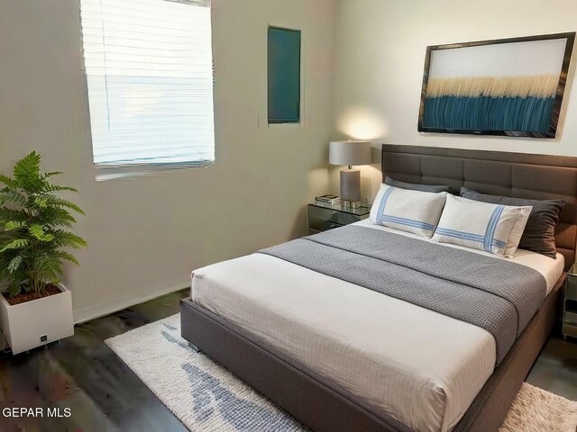 bedroom featuring wood finished floors