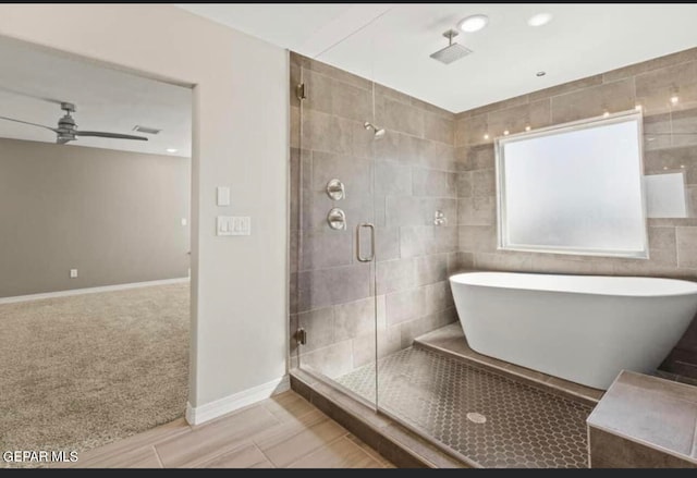 bathroom featuring tile floors, ceiling fan, tile walls, and separate shower and tub