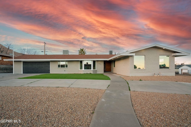 ranch-style house featuring a garage