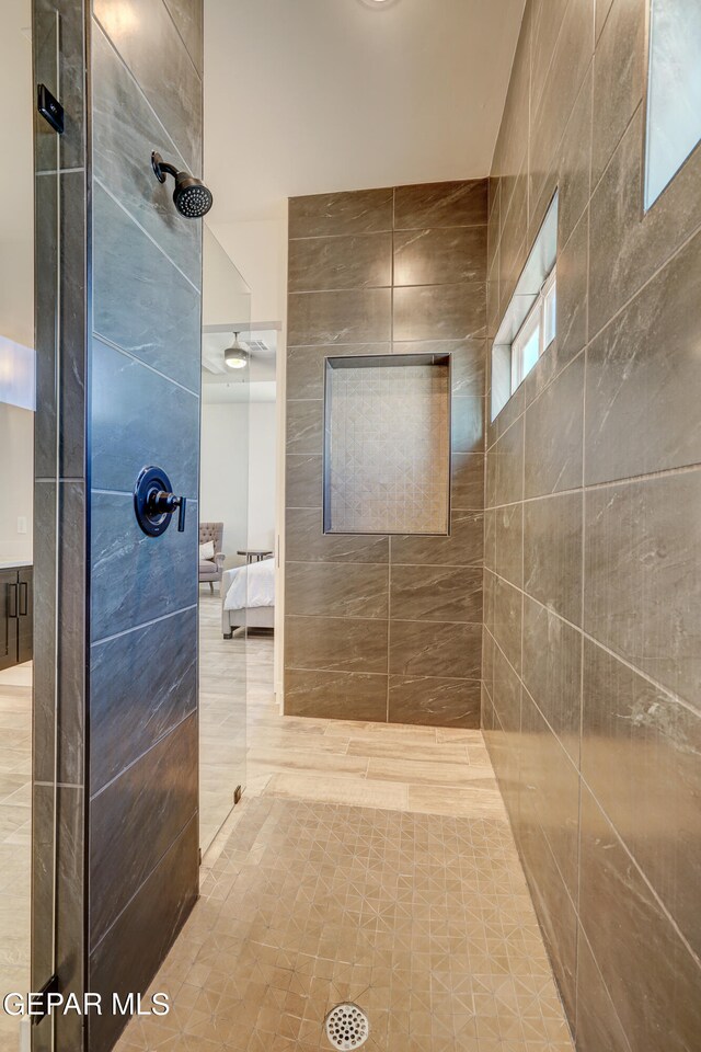 full bathroom featuring ensuite bath and tiled shower