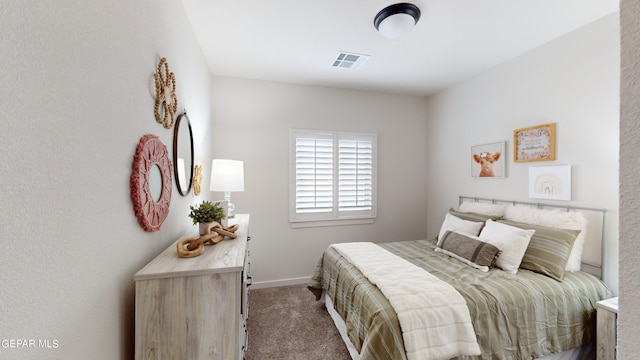 bedroom featuring carpet flooring, visible vents, and baseboards