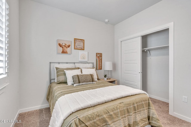 carpeted bedroom with a closet