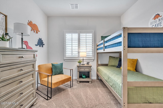 bedroom with carpet, visible vents, and baseboards