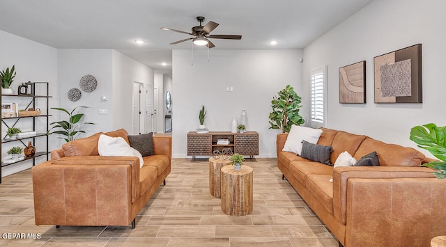 living area featuring ceiling fan, wood finish floors, baseboards, and recessed lighting