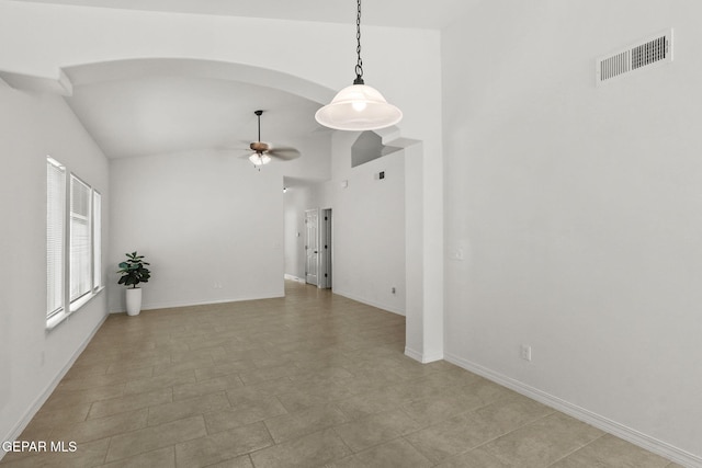 tiled spare room featuring high vaulted ceiling and ceiling fan