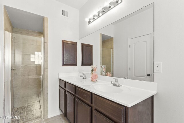 bathroom with vanity and an enclosed shower