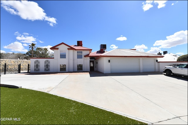 view of front of property featuring a garage