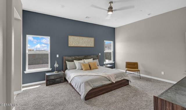 carpeted bedroom featuring ceiling fan