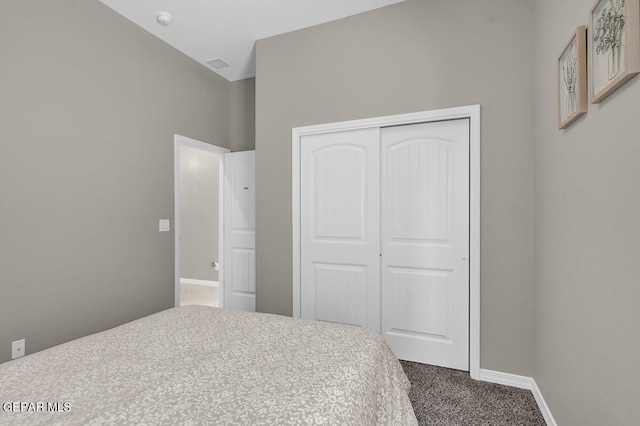 carpeted bedroom with a closet