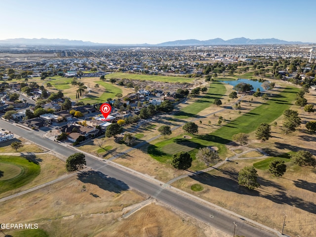 drone / aerial view featuring a water and mountain view