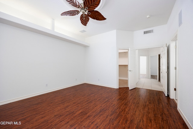 spare room with ceiling fan and hardwood / wood-style flooring