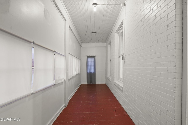 hallway with brick wall