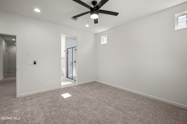 unfurnished bedroom featuring carpet flooring, connected bathroom, and ceiling fan