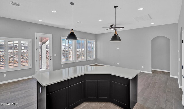 13357 Highworth Dr, El Paso, TX 79928 - kitchen featuring a center island, decorative light fixtures, light hardwood / wood-style flooring, and ceiling fan