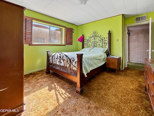 bedroom featuring dark colored carpet