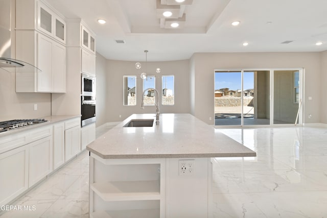 kitchen with marble finish floor, recessed lighting, a sink, an island with sink, and wall chimney exhaust hood