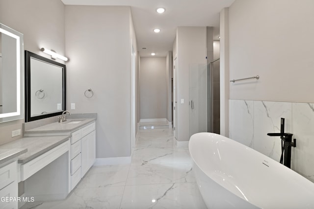 full bathroom featuring recessed lighting, vanity, a freestanding bath, marble finish floor, and a shower stall