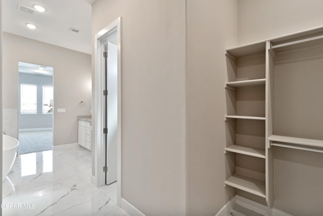 bathroom featuring recessed lighting, marble finish floor, visible vents, and baseboards