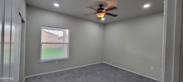 carpeted empty room with ceiling fan