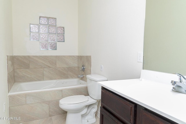 bathroom featuring tiled bath, toilet, and vanity