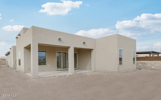 rear view of house with a patio