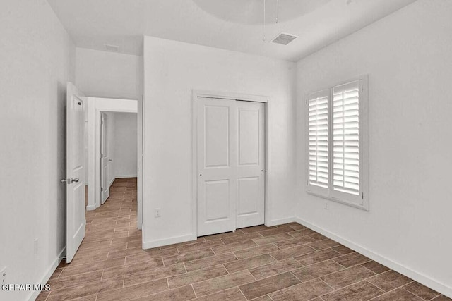 unfurnished bedroom featuring a closet