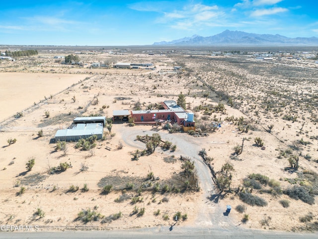 birds eye view of property featuring a mountain view