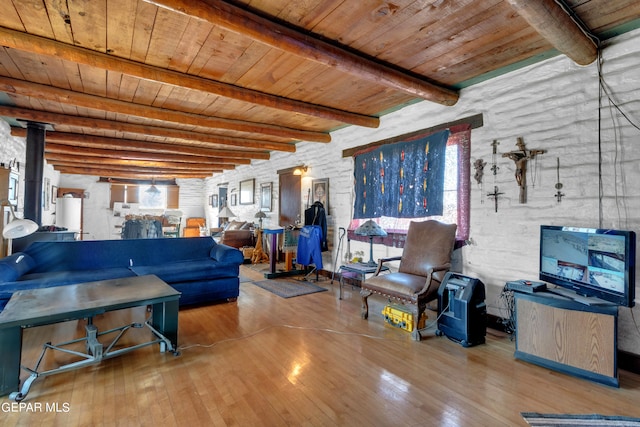 living room featuring beamed ceiling, wood ceiling, and light hardwood / wood-style floors