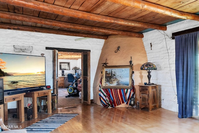 miscellaneous room featuring wood ceiling, dark hardwood / wood-style floors, and beamed ceiling