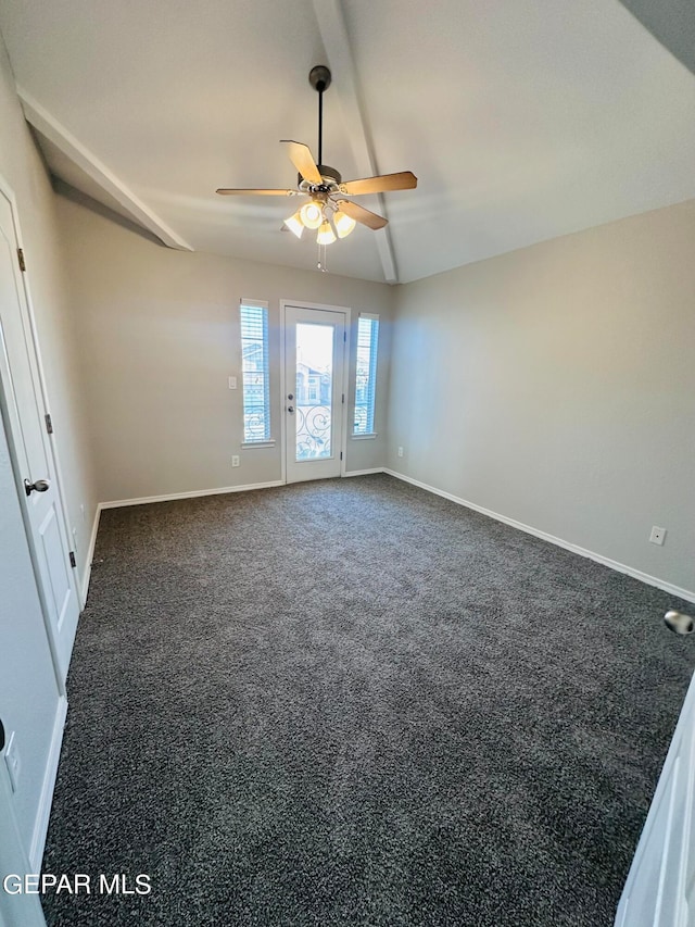 carpeted empty room featuring ceiling fan and lofted ceiling with beams