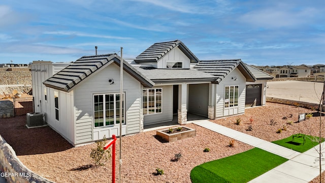 view of front of property featuring central AC unit