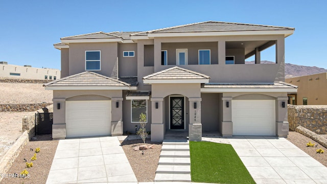 1848 Cimarron Park Dr, El Paso, TX 79911 - view of front of home featuring a garage, stucco siding, and driveway