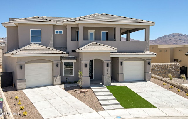 1848 Cimarron Park Dr, El Paso, TX 79911 - view of front of house featuring an attached garage, concrete driveway, and stucco siding