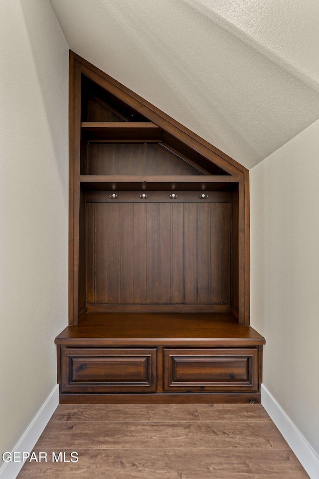 1848 Cimarron Park Dr, El Paso, TX 79911 - mudroom featuring baseboards, wood finished floors, and vaulted ceiling