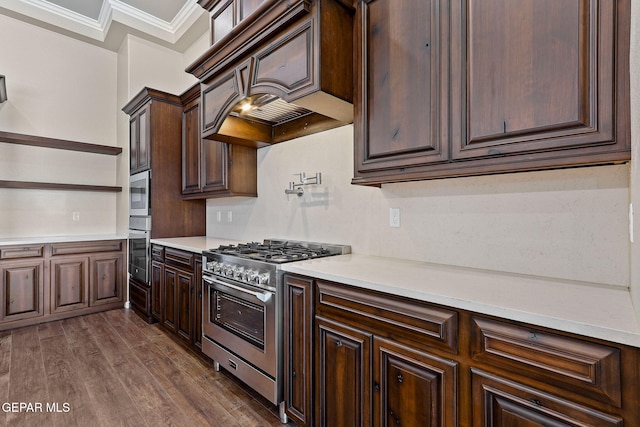 1848 Cimarron Park Dr, El Paso, TX 79911 - kitchen with light countertops, dark brown cabinetry, high end stainless steel range oven, and dark wood-style floors